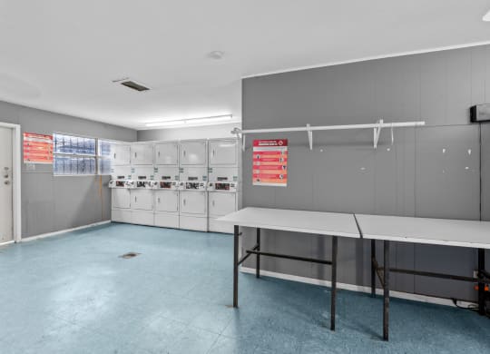 a locker room with lockers and a table  at Sunset Heights, San Antonio