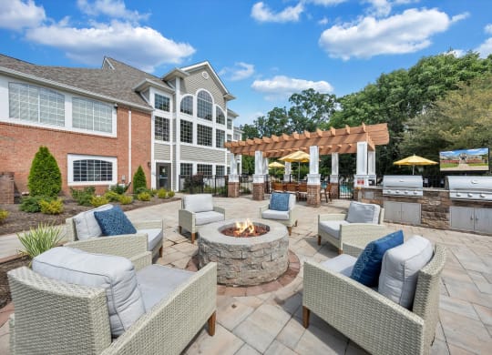 the estates at tanglewood|furnished patio with fire pit and seating area at Sunscape Apartments, Roanoke, Virginia