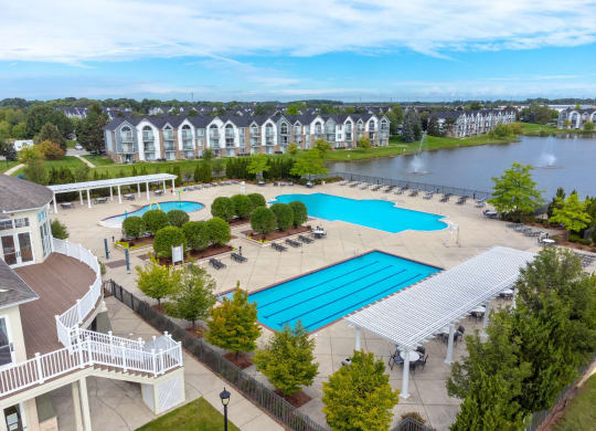 an aerial view of the resort style pool and hot tub at The Harbours Apartments, Clinton Twp, MI