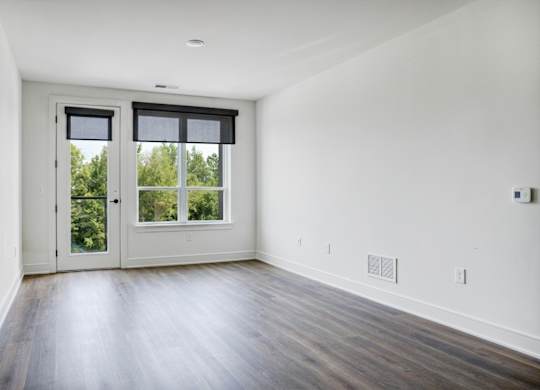 A room with a sliding door and a window.