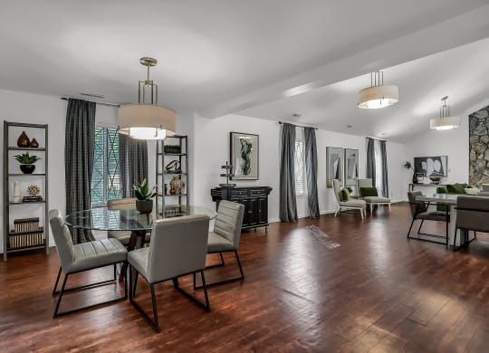 a living room and dining room with a table and chairs at Polo Run Apartments, Greenwood