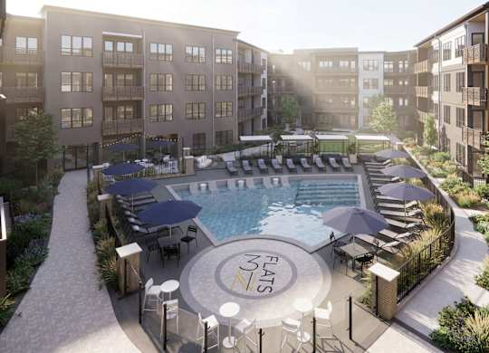 Courtyard pool with sundeck and lounge seating at 3 Notch'd Flats Apartments, Henrico, Virginia