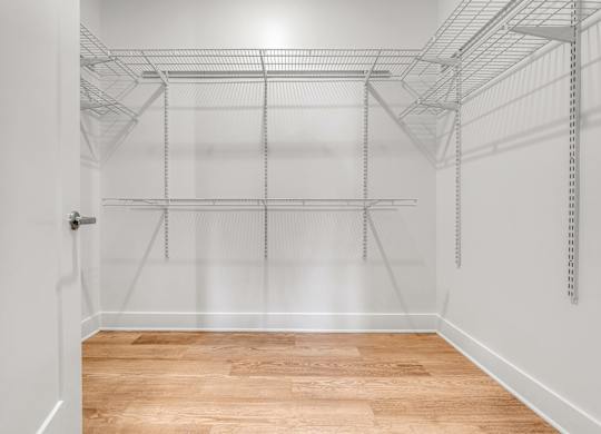 Walk-in closet with wire shelving at 3 Notch'd Flats Apartments, Henrico