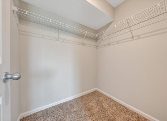 a walk in closet in a bedroom at Sunscape Apartments, Virginia