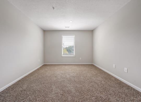 an empty room with a window at Sunscape Apartments, Roanoke, Virginia