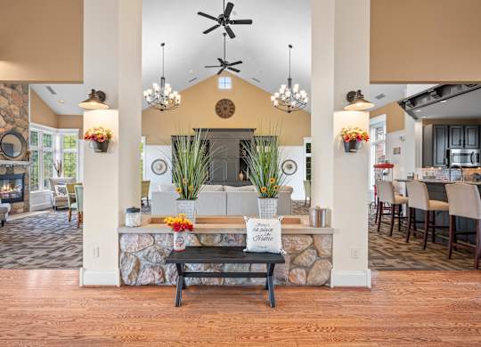 A room with a stone wall and a wooden floork at Timberlane Apartments, Peoria, Illinois