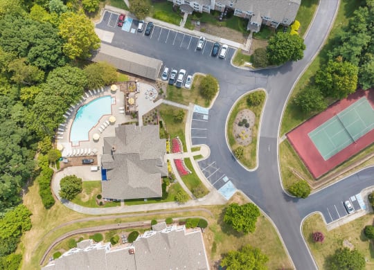 arial view of a house with a swimming pool and tennis court at Sunscape Apartments, Roanoke, VA, 24018