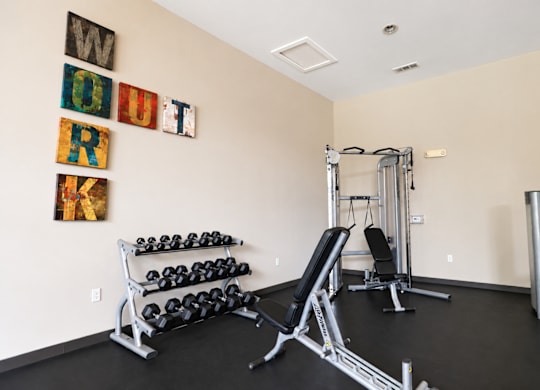 A gym with weights and exercise equipment.