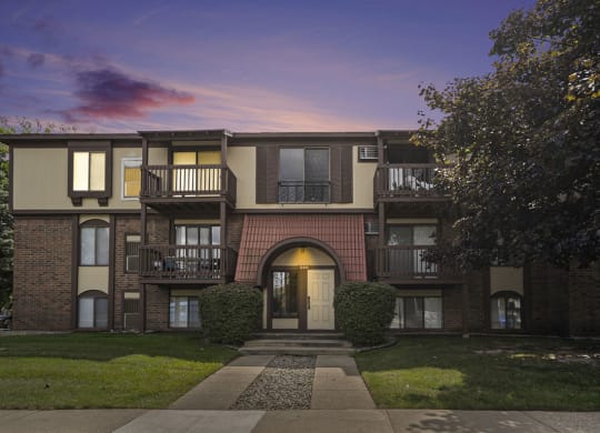 an apartment building at dusk at Apple Ridge Apartments, Michigan, 49534