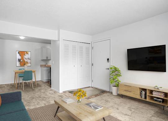 A living and dining room with plush carpeting  at Apple Ridge Apartments, Walker, MI