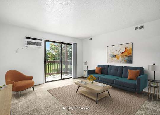 A living room with a slider to a balcony at Apple Ridge Apartments, Walker, MI