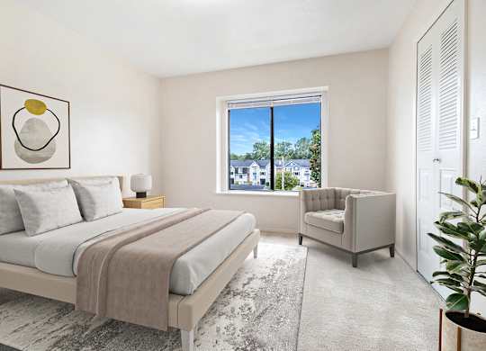 A bedroom with a large bed and a window at Arbor Lakes Apartments, Elkhart, IN