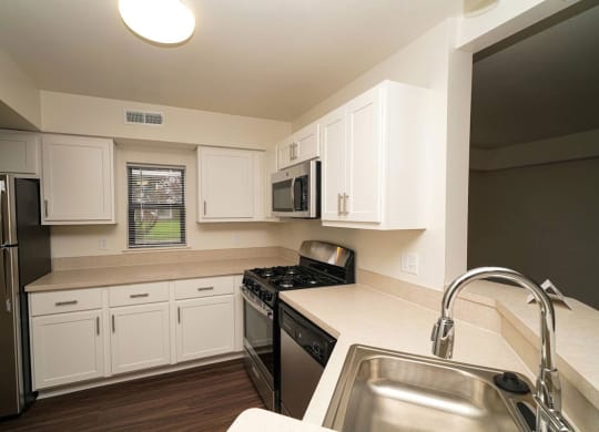 a renovated end style kitchen with a window  at Arbor Lakes Apartments, Indiana, 46516