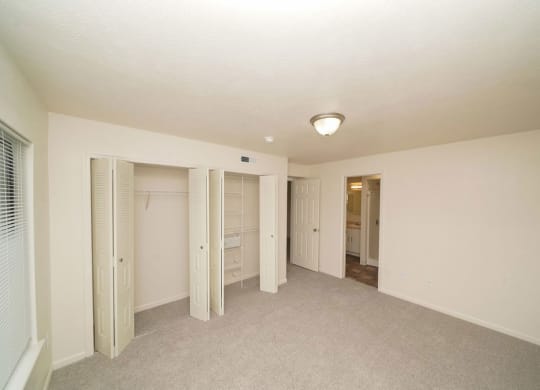 bedroom with a walk-in closet with wardrobe organizers  at Arbor Lakes Apartments, Elkhart, IN, 46516
