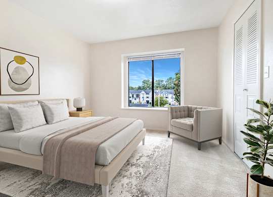 A bedroom with a large bed, a window and a closet at Autumn Lakes Apartments and Townhomes in Mishawaka, IN