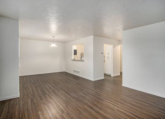 A room with wooden flooring and white walls at Autumn Lakes Apartments and Townhomes, Mishawaka, 46544