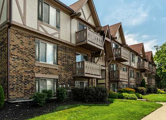 A row of apartment buildings with balconies and windows