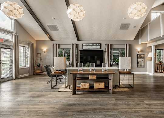 A modern living room with a wooden floor and a fireplace