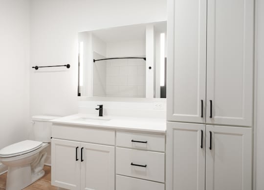 a bathroom with white cabinets and a toilet and a sink at Avant & Avant II, Carmel, IN, 46032
