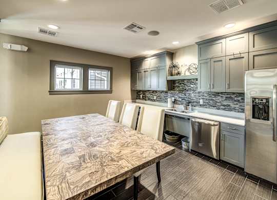 a kitchen with stainless steel appliances and a wooden table at Avellan Springs Apartments, North Carolina