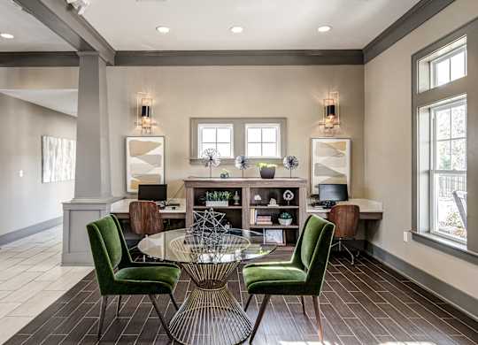 a living room with a round table and green chairs at Avellan Springs Apartments, Morrisville, NC, 27560