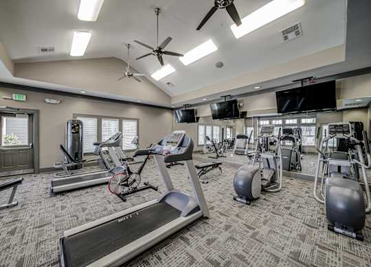 our fitness center is equipped with state of the art equipment including cardio machines and weights at Avellan Springs Apartments, Morrisville, NC, 27560