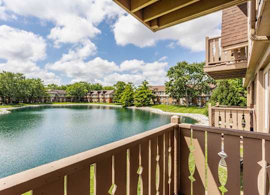 A view from a balcony overlooking a lake