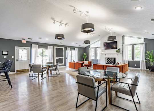A modern dining room with a glass table and chairs
