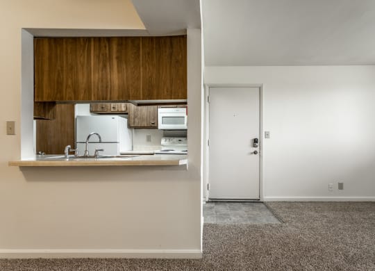 a view of a kitchen and a door in a house at Bay Pointe Apartments in Lafayette, Indiana 47909