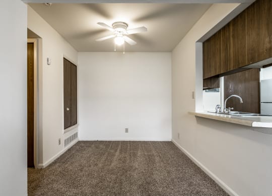 an empty room with a sink and a ceiling fan at Bay Pointe Apartments in IN 47909