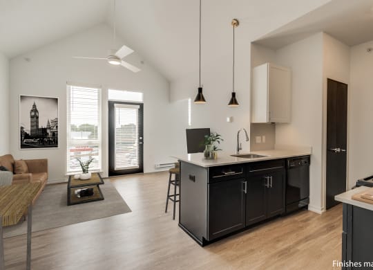 a kitchen and living room in a 555 waverly unit  at Uptown Square Apartments, Troy, MI, 48083