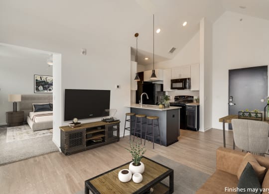 a view of the living room and kitchen from the dining area  at Uptown Square Apartments, Troy, MI
