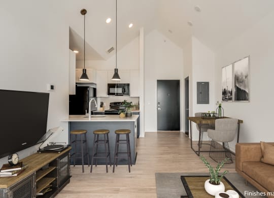 a kitchen and living room with white walls and wood flooring  at Uptown Square Apartments, Troy