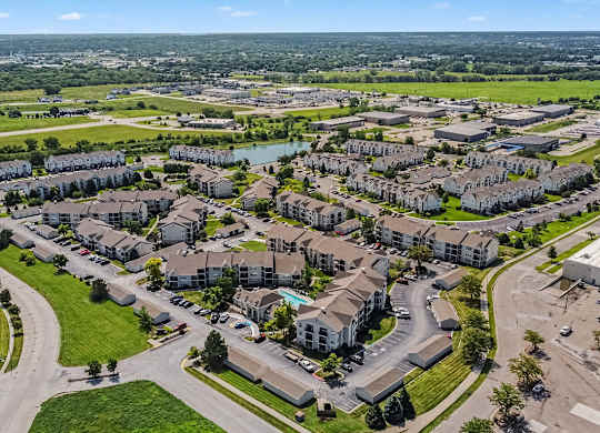 Aerial view of apartment community with pond at Black Sand Apartments Homes, Lincoln, 68504