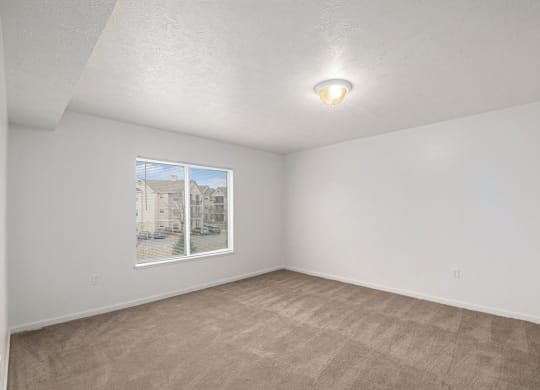 spacious bedroom with a large window  at Black Sand Apartment Homes, Lincoln, NE