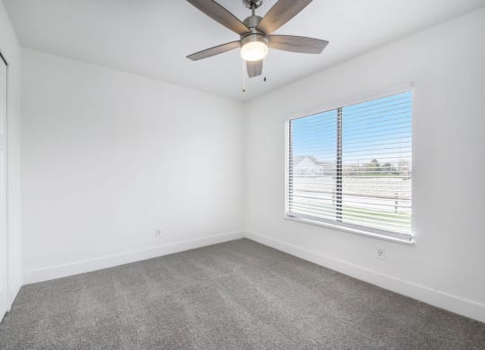 Bedroom with Ceiling Fan at Byron Lakes Apartments, Byron Center, Michigan