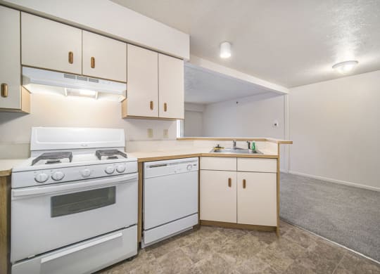 a kitchen with breakfast bar at Canal 2 Apartments, Lansing, 48917