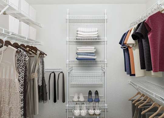 walk-in closet with wardrobe organizers at Canal 2 Apartments in Lansing, MI