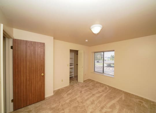 Walk In Closet with Organizers at Canal Club Apartments in Lansing, MI