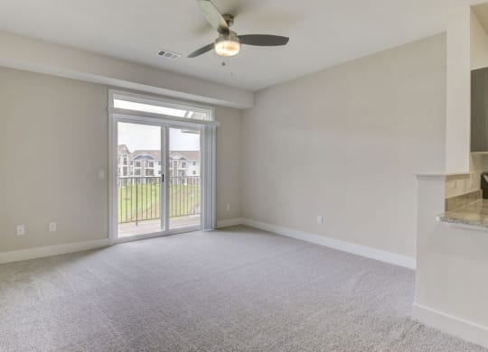 Living Room Leads To Private Balcony at Chase Creek Apartment Homes, Huntsville, AL, 35811