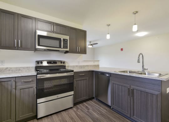 Kitchen with Breakfast Bar at Chase Creek Apartment Homes, Huntsville, AL, 35811