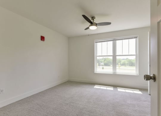 Bedroom with a Ceiling Fan at Chase Creek Apartment Homes, Huntsville, AL, 35811