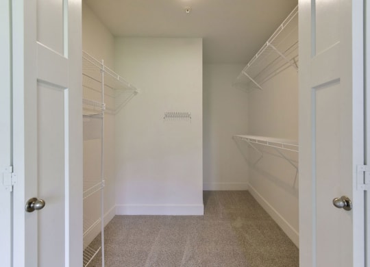 a walk in closet in a home  at Chase Creek Apartment Homes, Huntsville