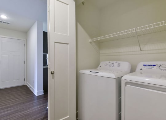 a laundry room with a washer and dryer at Chase Creek Apartment Homes, Huntsville, 35811