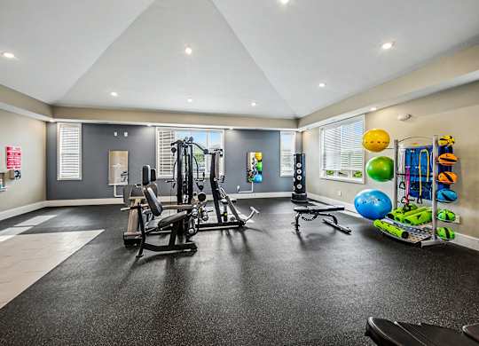 A spacious fitness center with a variety of exercise equipment at Chase Creek Apartment Homes, Huntsville, AL, 35811