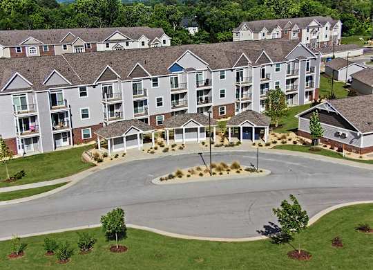 A large apartment complex with a central mail and package receiving area at Chase Creek Apartment Homes, Huntsville, 35811