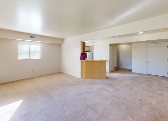 enlarged living room with extra window at Canal Club Apartments, Lansing, 48917