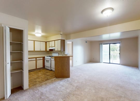Two bedroom one bath living room and kitchen at Canal Club Apartments, Michigan, 48917