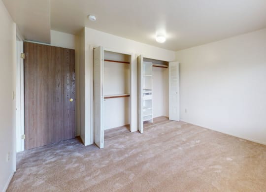 a bedroom with a large closet and a wardrobe organizer at Canal Club Apartments, Michigan