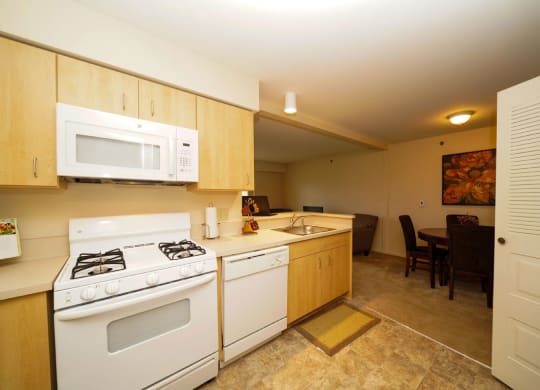 Gas Stove and Dishwasher at Colonial Pointe at Fairview Apartments, Nebraska, 68123
